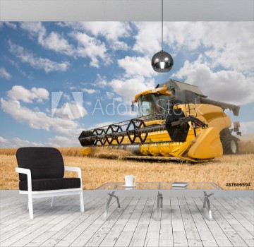 Picture of close view of modern combine harvester in action